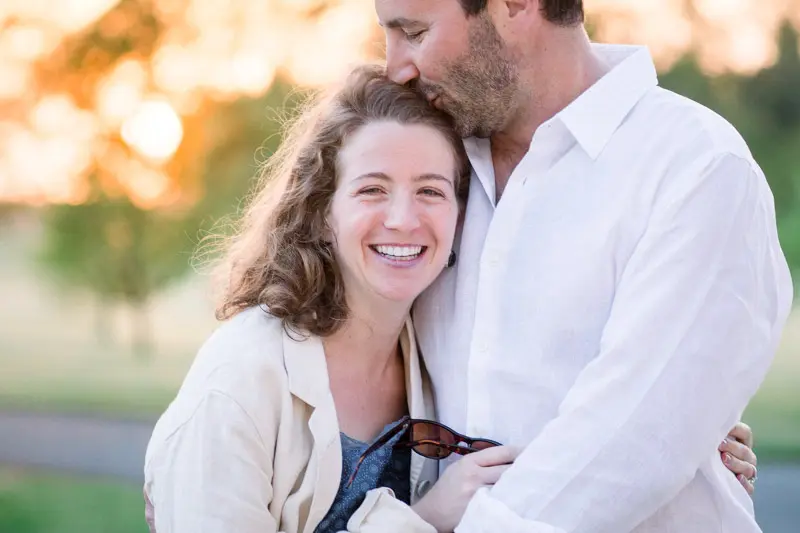 A couple of guests embracing in golden evening light at Château Grattequina