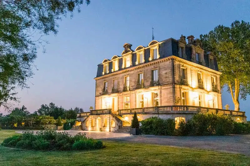 Château Grattequina lit up at blue hour