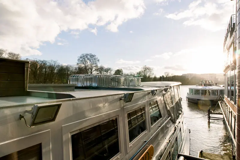 Riverboat moored on the Seine under a sunny winter sky