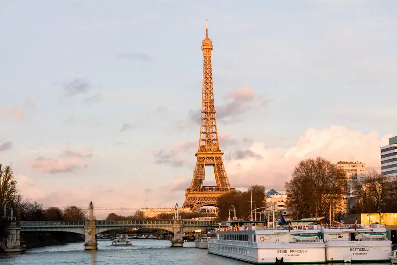 The Eiffel Tower at sunset seen from the Seine