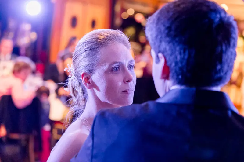 Bride and groom gazing at each other during the evening on the boat