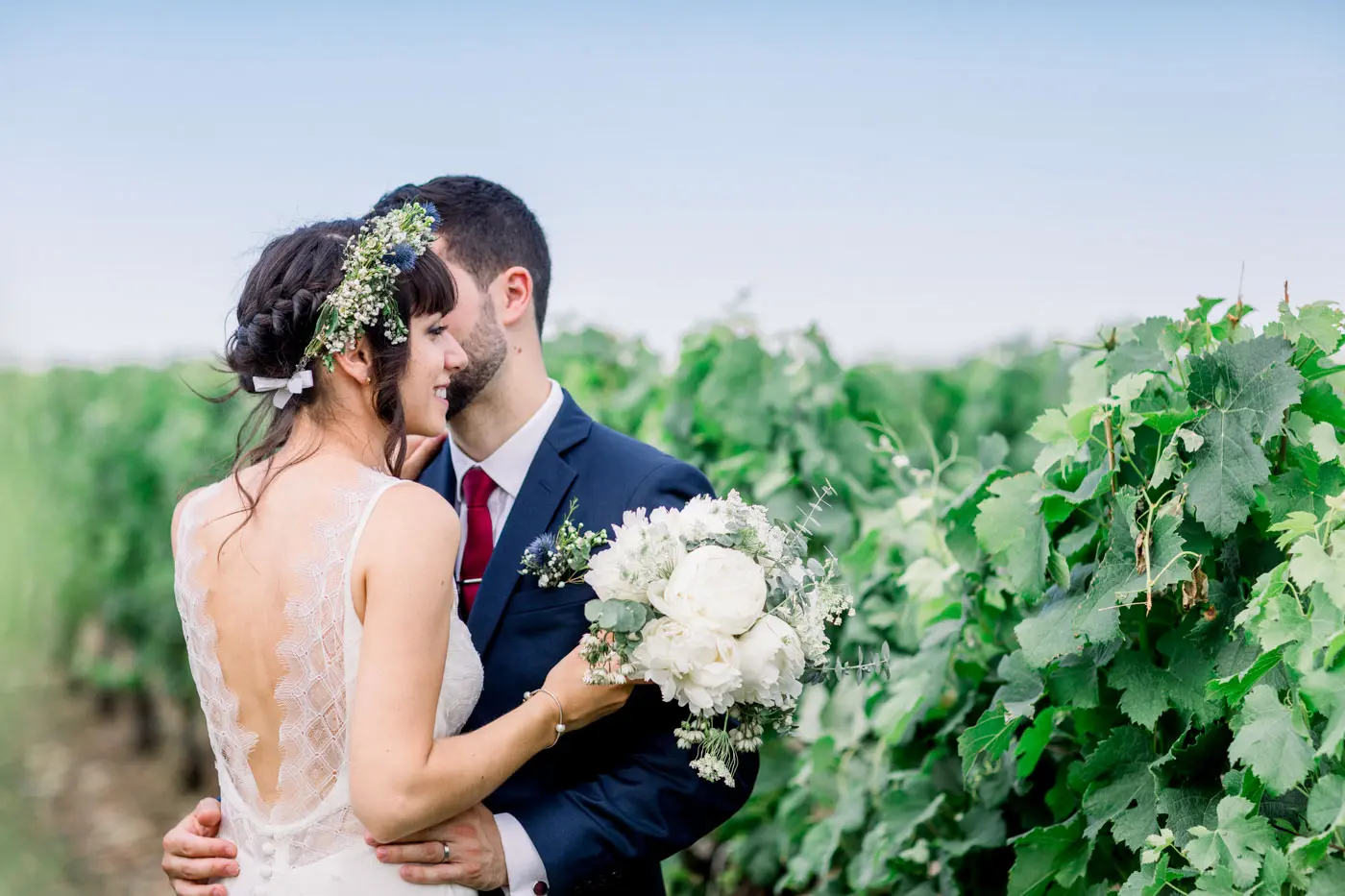 Marie-Anne and Vincent embracing in the vineyards of Château Goudichaud