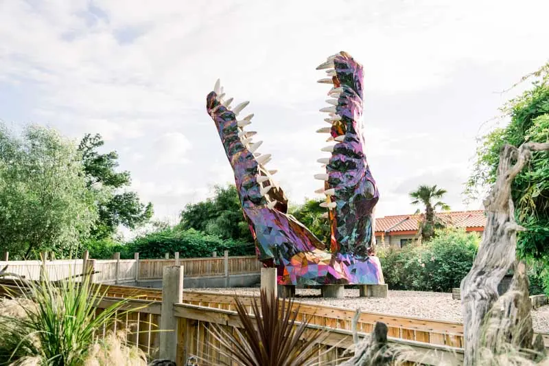 Colourful reptile-shaped sculpture in the garden of La Maison du Fleuve, Camblanes-et-Meynac