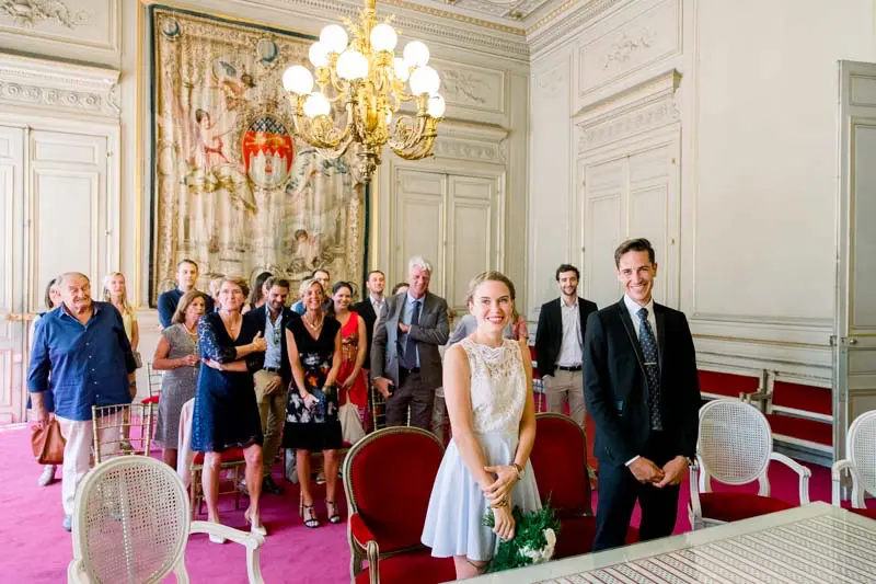The couple and their families in the wedding room of Bordeaux town hall