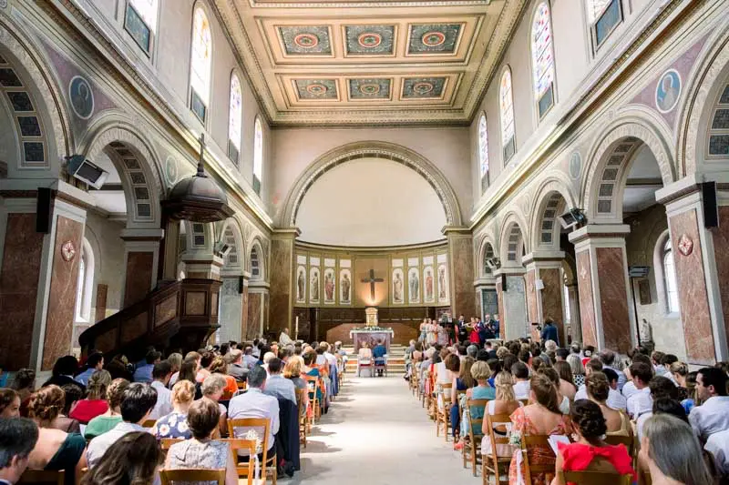 Nave of the Saint-Martial church in Bordeaux filled with guests during the ceremony