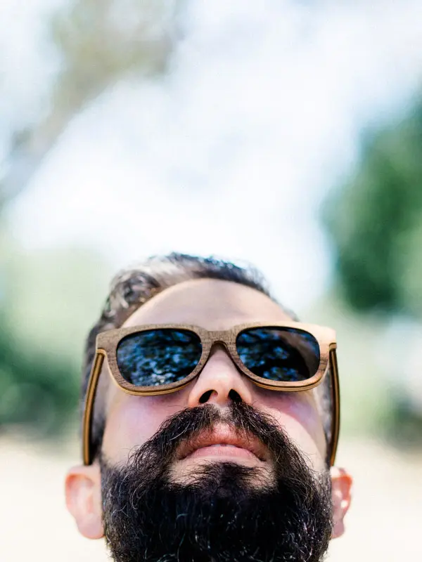 Groom in sunglasses on his wedding day at Château de Seguin