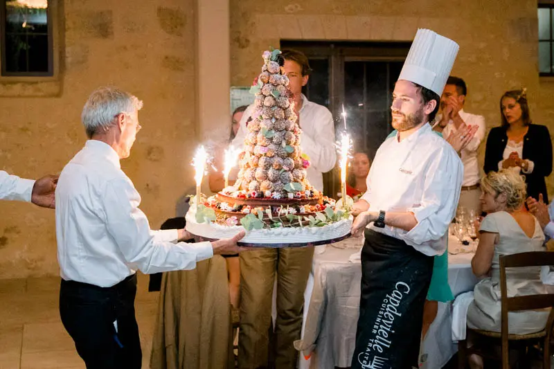 The croquembouche wedding cake arriving with sparklers ablaze