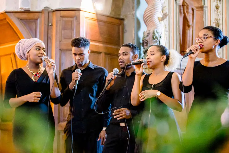 Gospel choir singing during the ceremony at Saint-Pierre church in Bègles