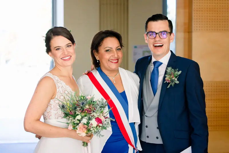 The newlyweds beside the official wearing the tricolour sash at Pessac town hall
