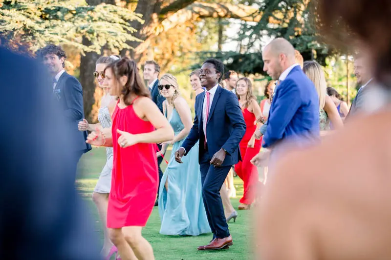 Guests dancing a flash mob on the lawn at Château Pape Clément