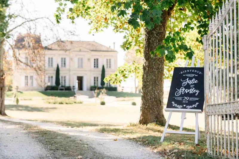 The drive of Château de Garde with Julie and Stan's welcome chalkboard