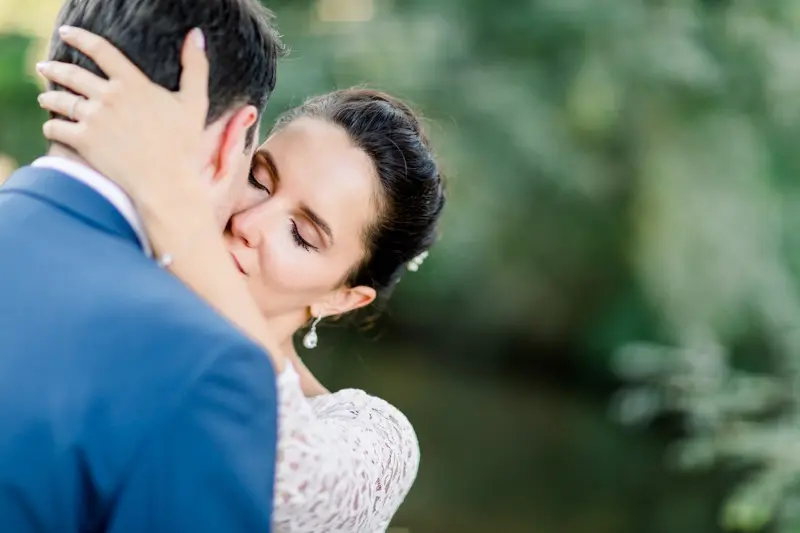 Bride with her hand on the groom's cheek in a tender moment