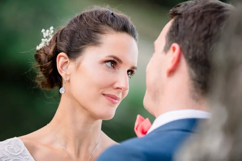 Bride smiling at the groom in the evening light at Château Giscours