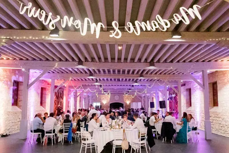 Ferme Suzanne hall with illuminated Monsieur et Madame lettering