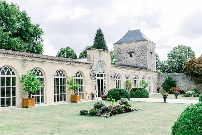 Arched-window orangery and tower of Château de la Ligne