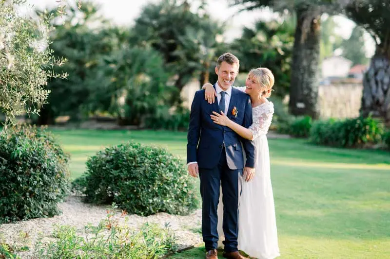 Bride and groom embracing in the middle of the Château Pape Clément gardens