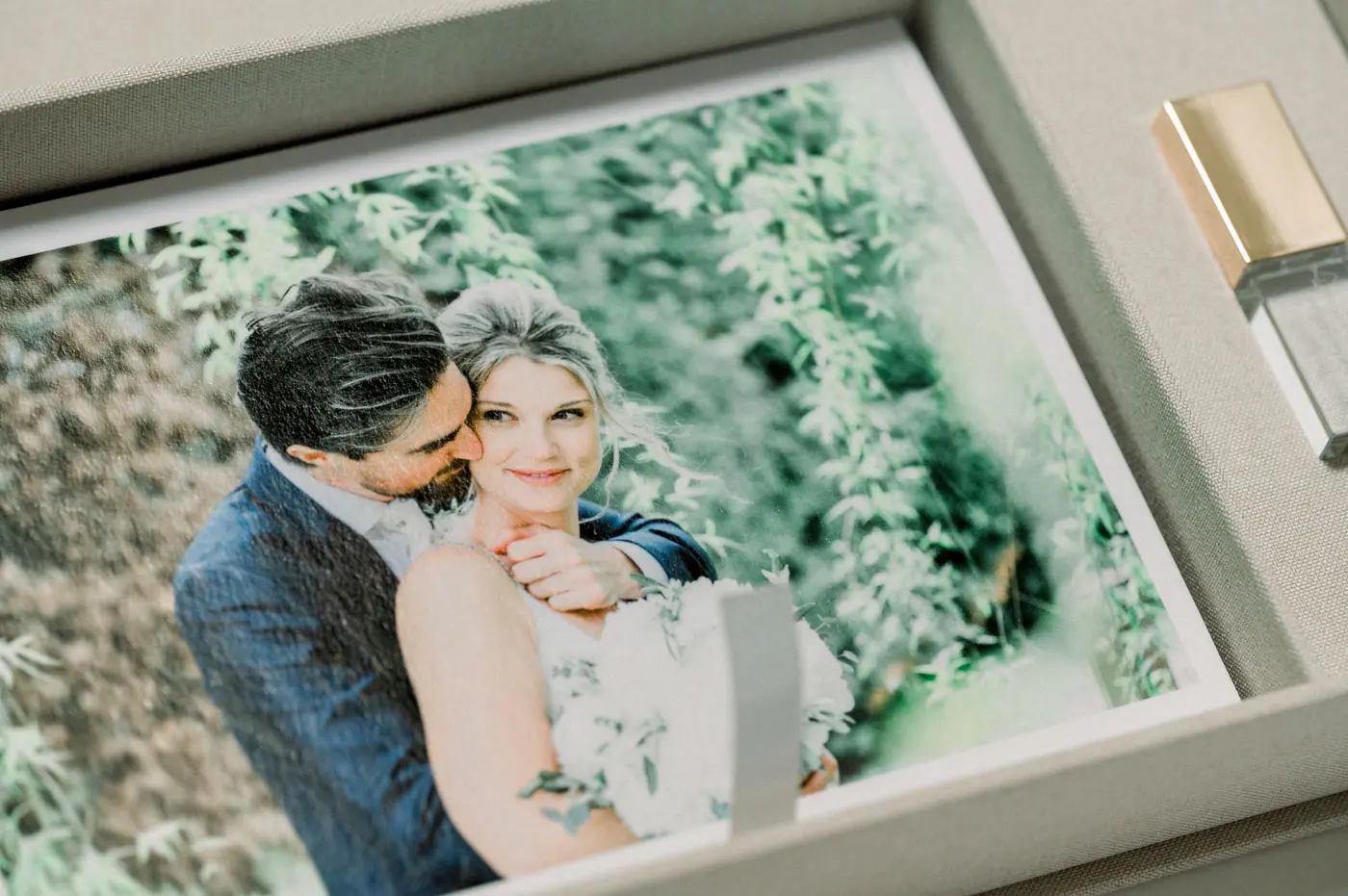 Close-up of the fine art print of the newlyweds in the linen box