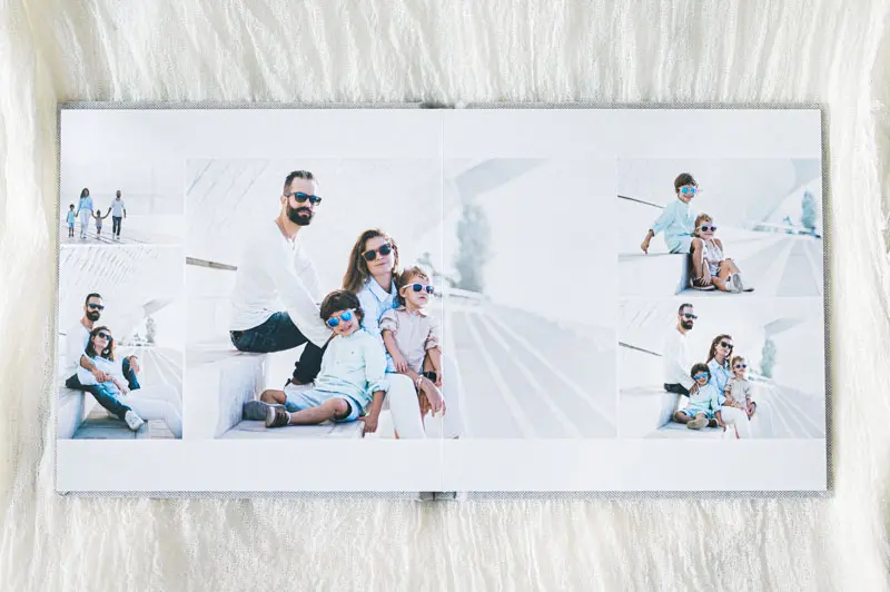 Spread of a family photo book with pictures of parents and children
