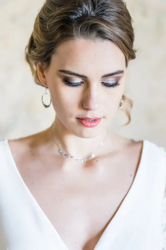 Close-up of the bride's make-up with her eyes lowered