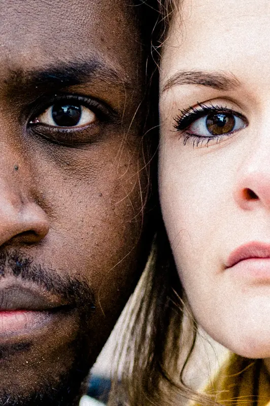 Split portrait showing one eye of each partner side by side