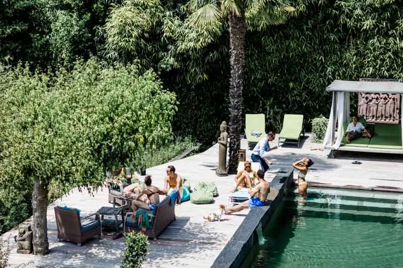 The couple's friends relaxing around the villa pool before the ceremony
