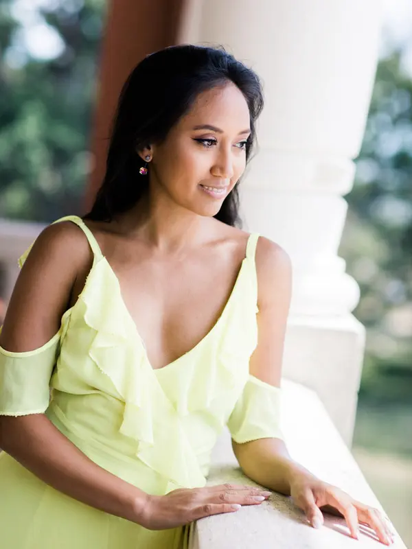 A friend in a yellow dress gazing out from the Villa La Tosca balustrade