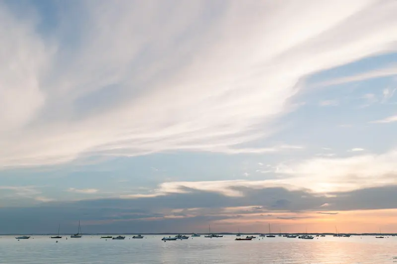 Sunset over Arcachon Bay and the boats at anchor