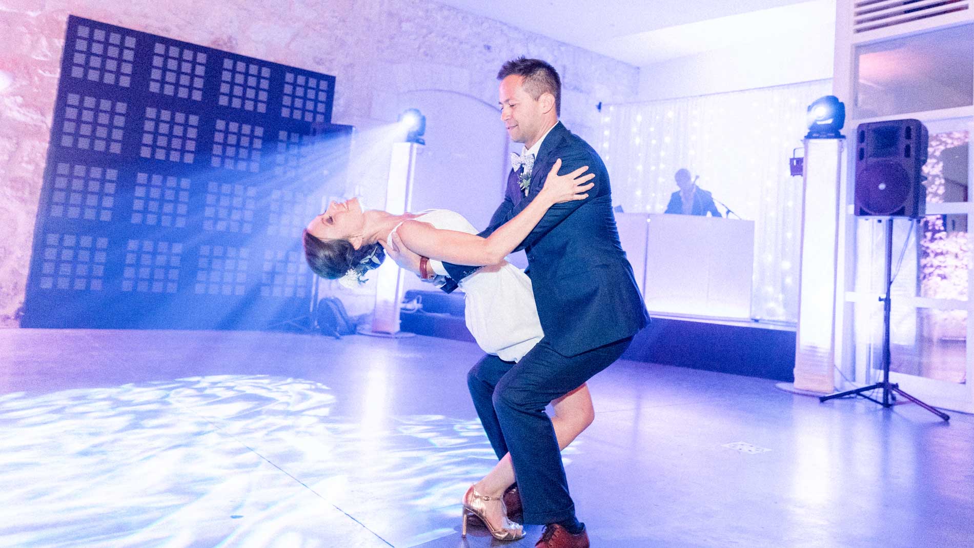 First dance: the groom dips the bride on the dance floor