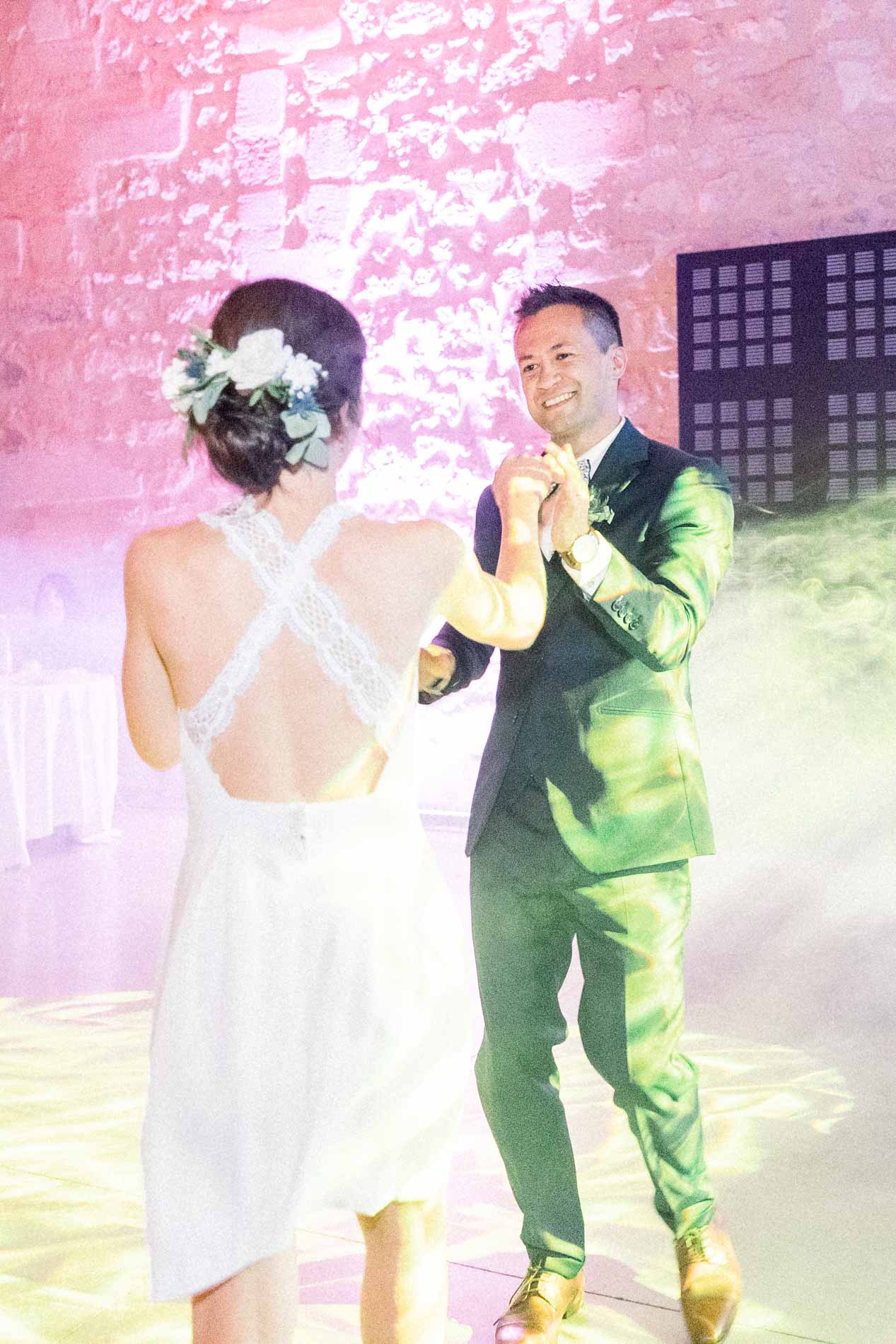 The couple's first dance amid smoke and pink lights