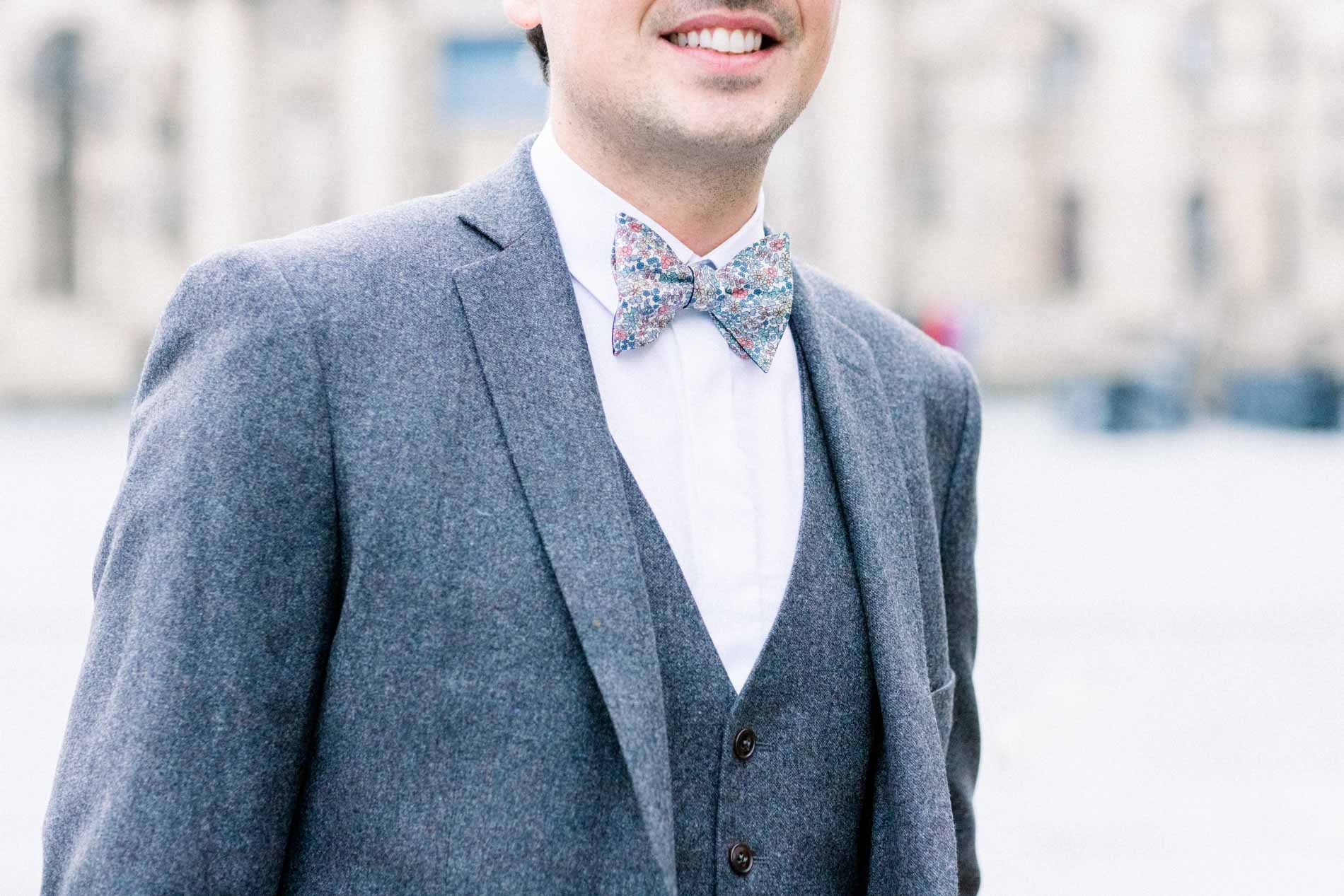 Detail of the groom's Blandin et Delloye suit and bow tie