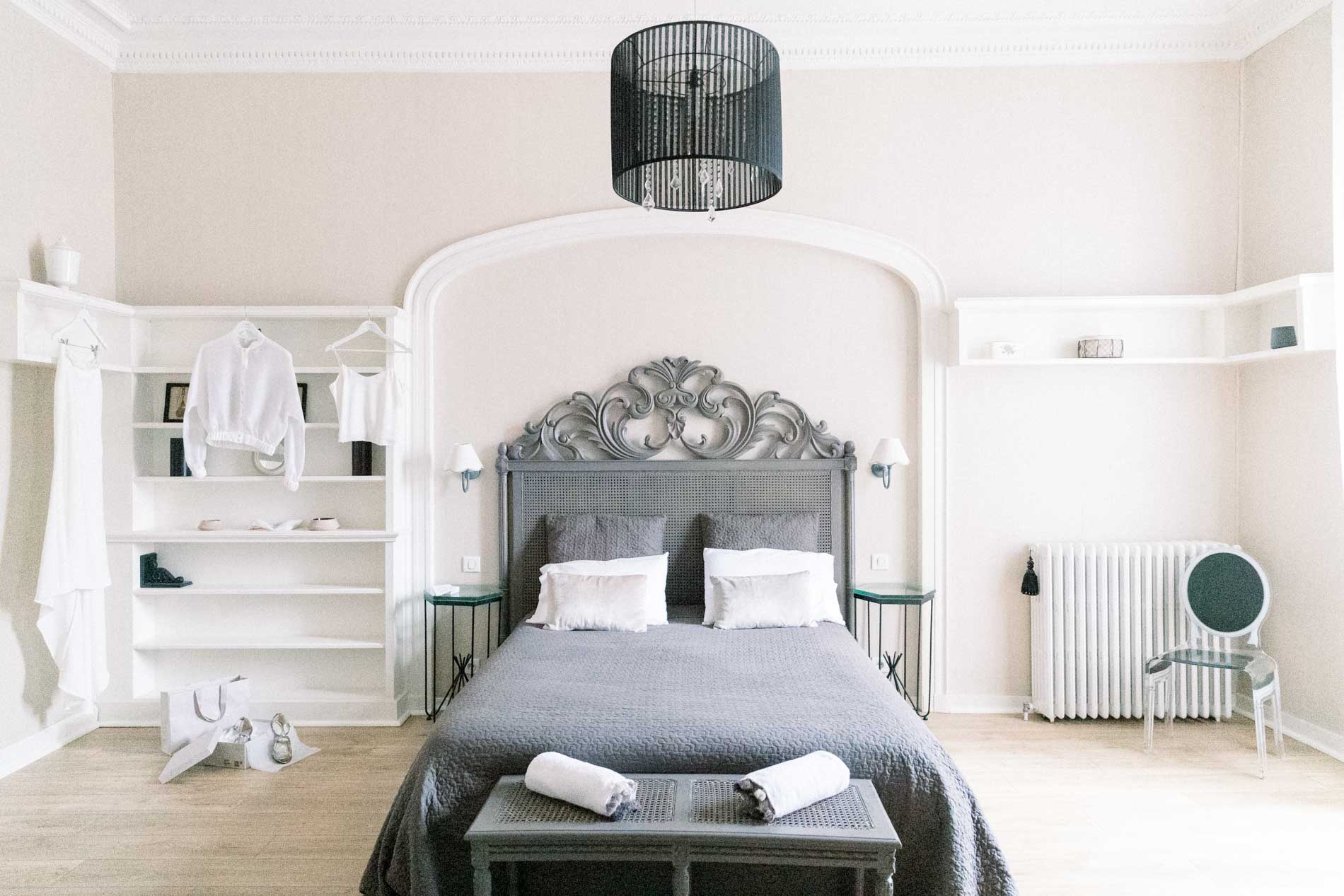 The bridal suite at the Chartreuse des Eyres with its wrought iron headboard