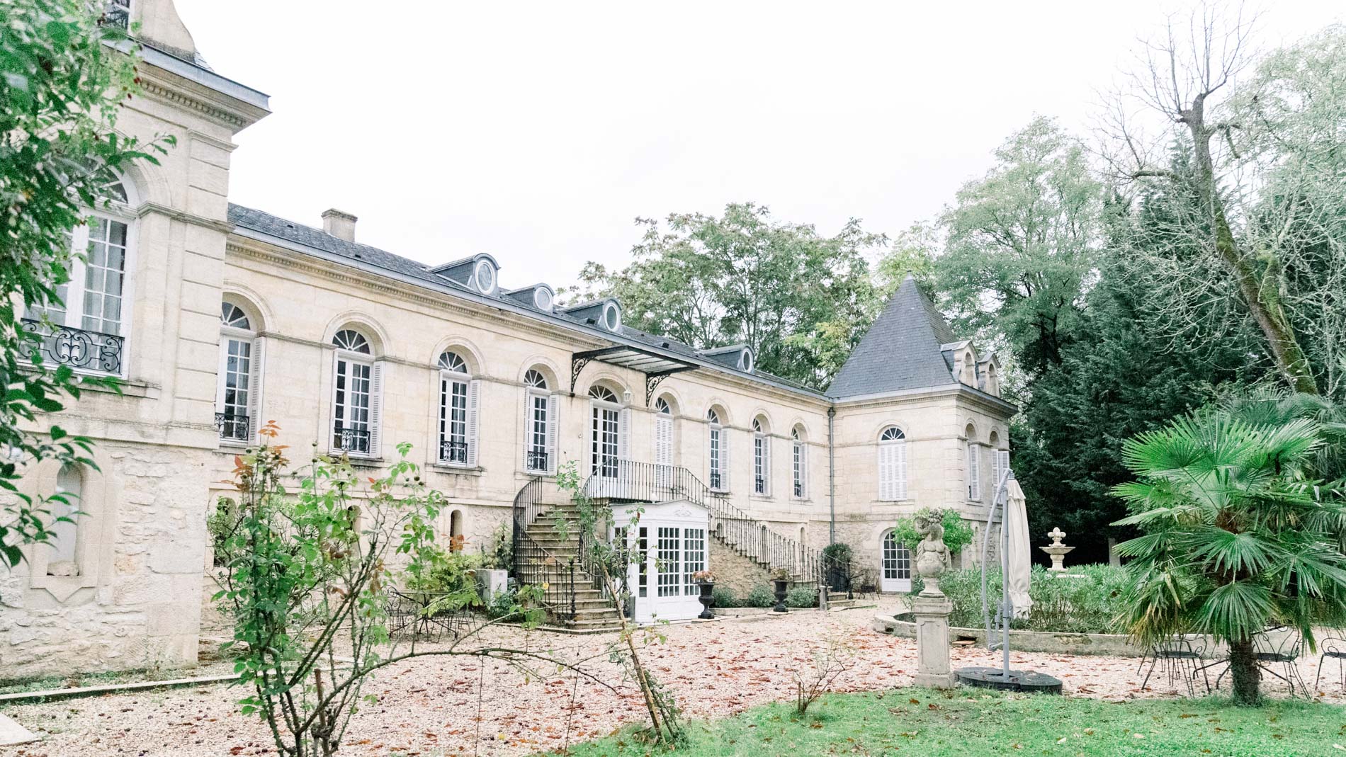 Stone facade of the Chartreuse des Eyres and its wooded grounds