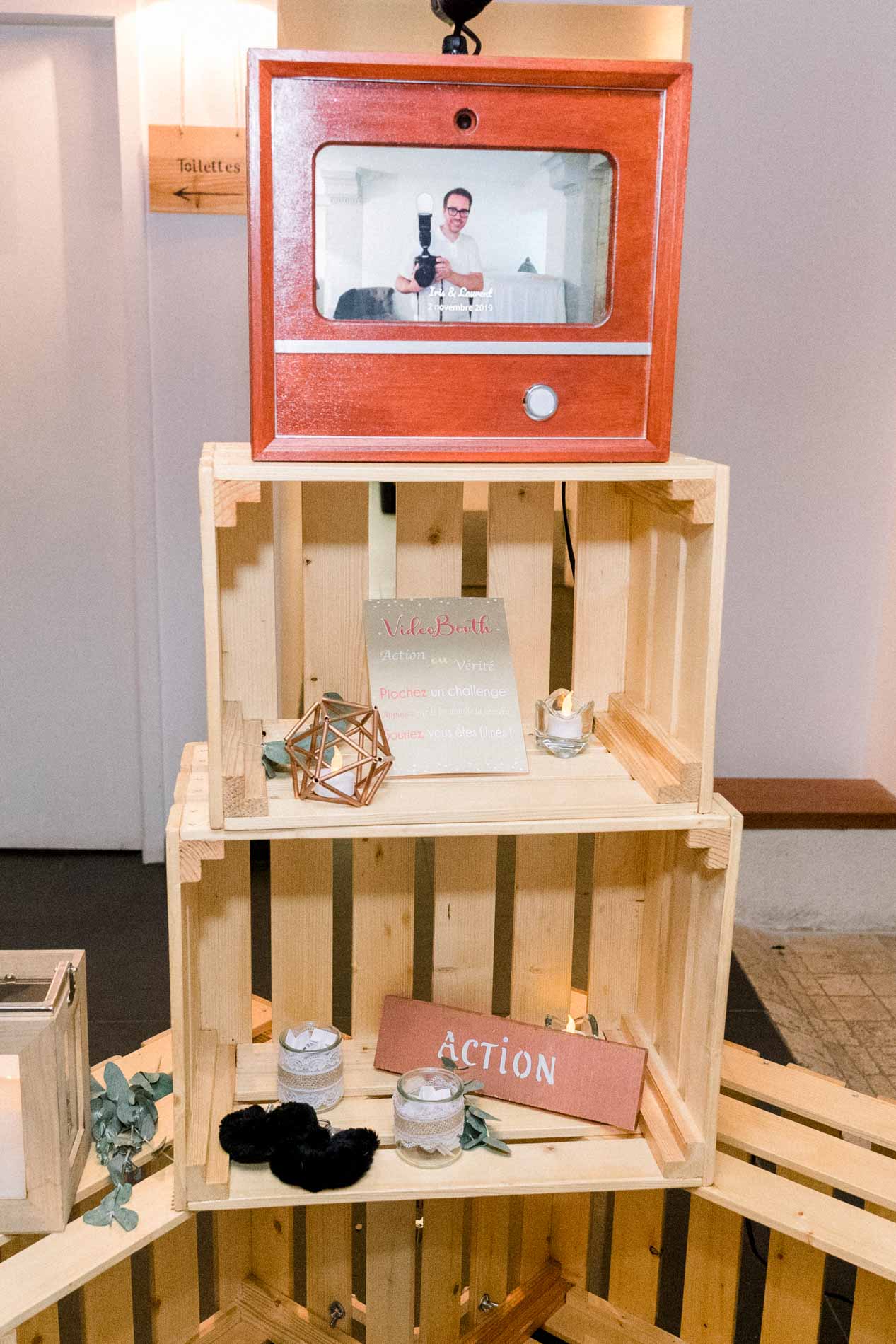 Retro video booth set up on wooden crates for the guests
