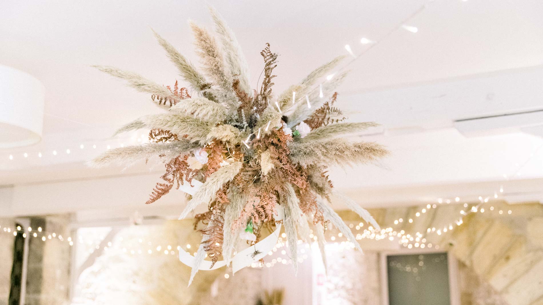 Dried flower installation hanging above the tables in the reception room