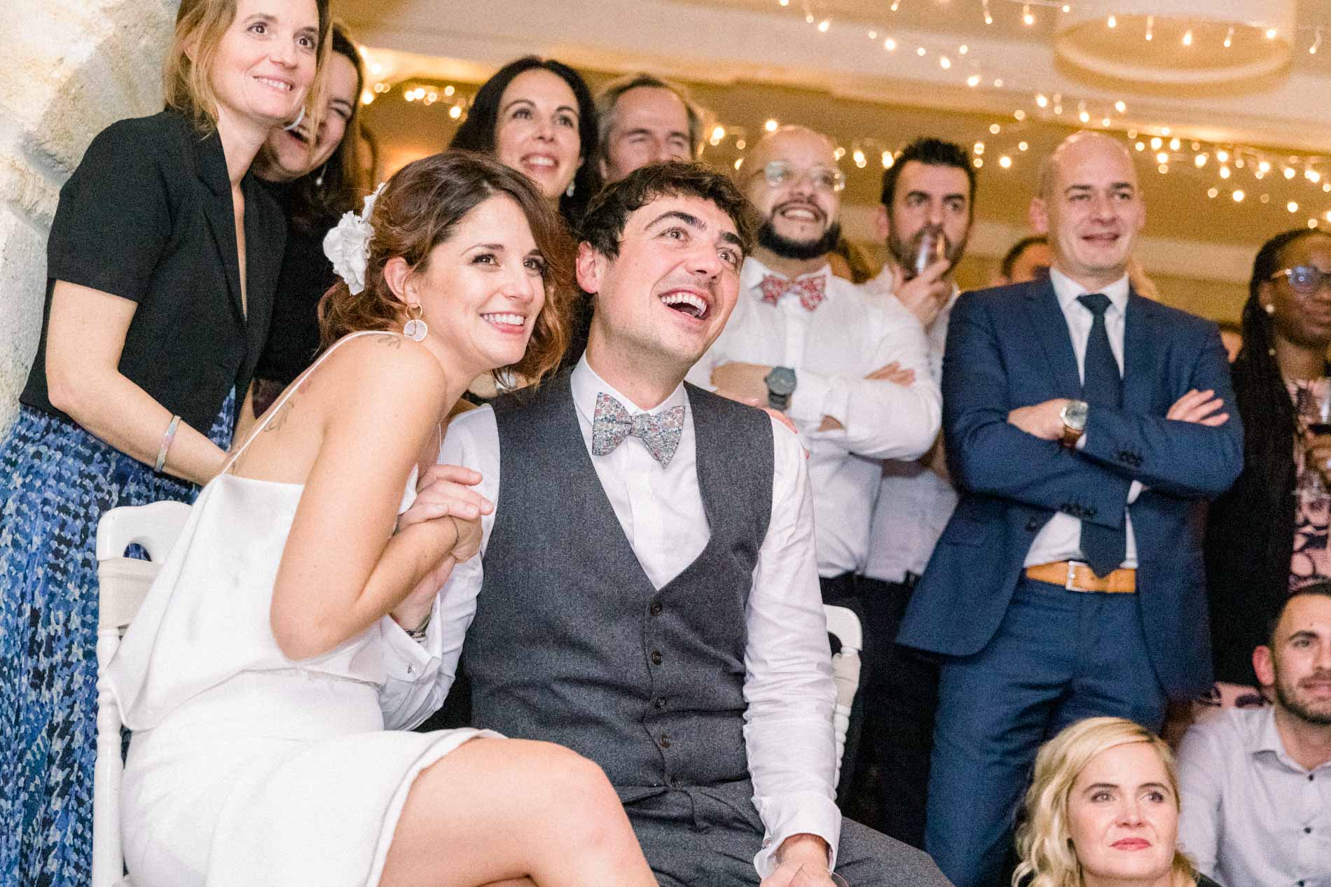 The couple and their guests reacting to a surprise prepared for them