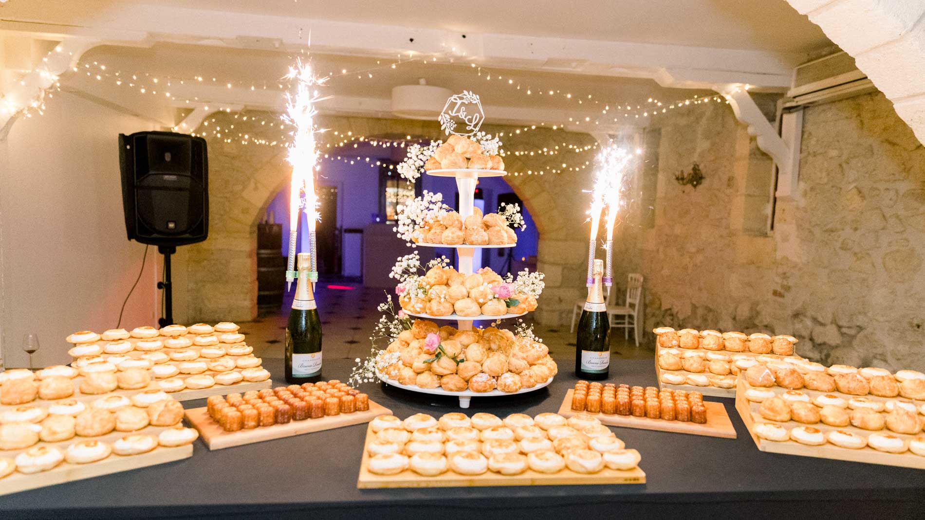 Choux pastry tower with sparklers on the dessert table