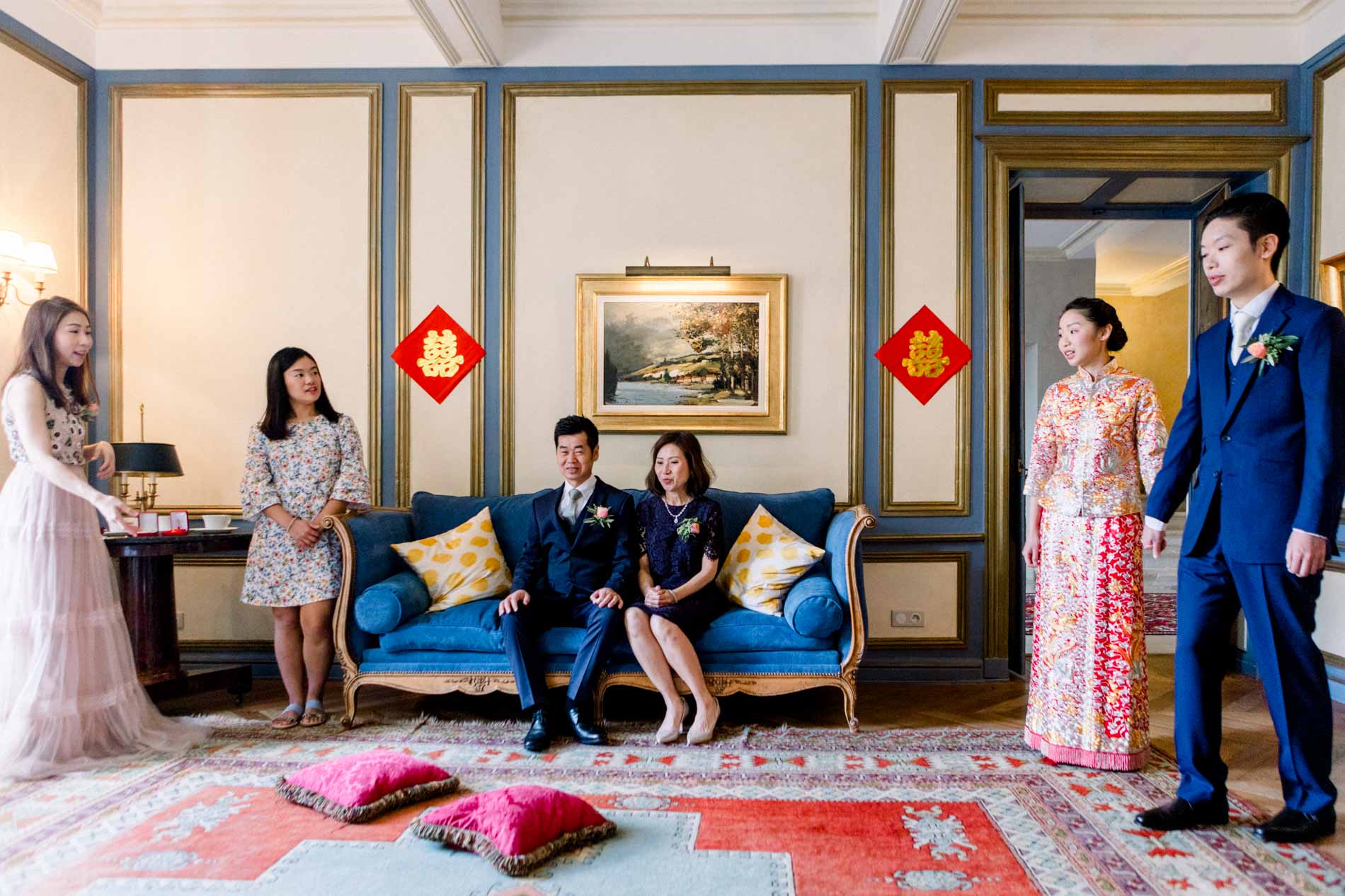Family gathered in a lounge decorated with red lanterns for the tea ceremony