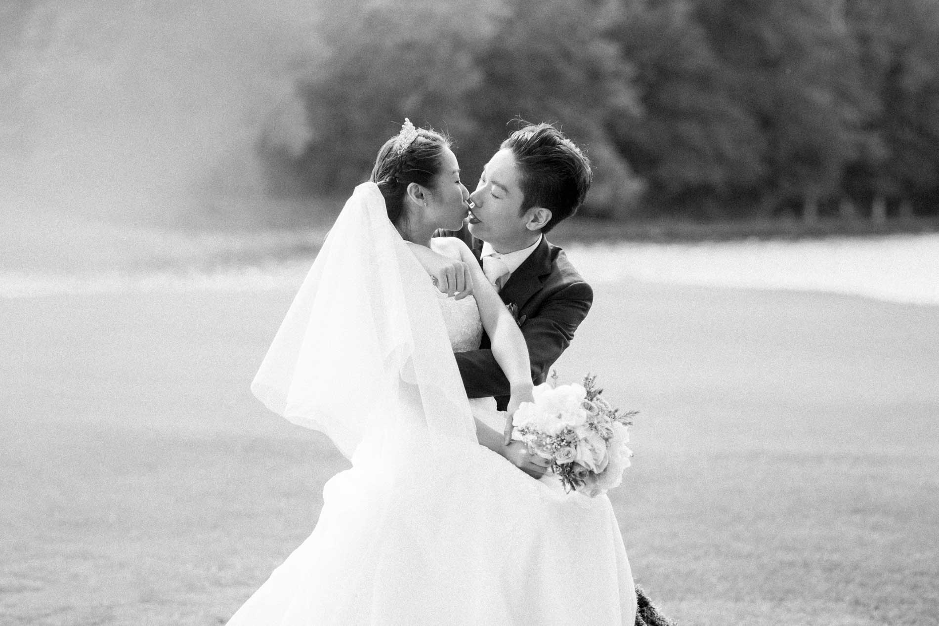 The couple embracing on the golf course, in black and white
