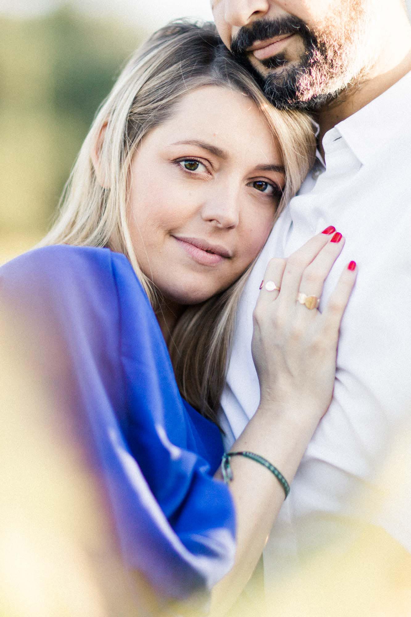 Bérengère, her hand on Nicolas's chest, looking into the camera
