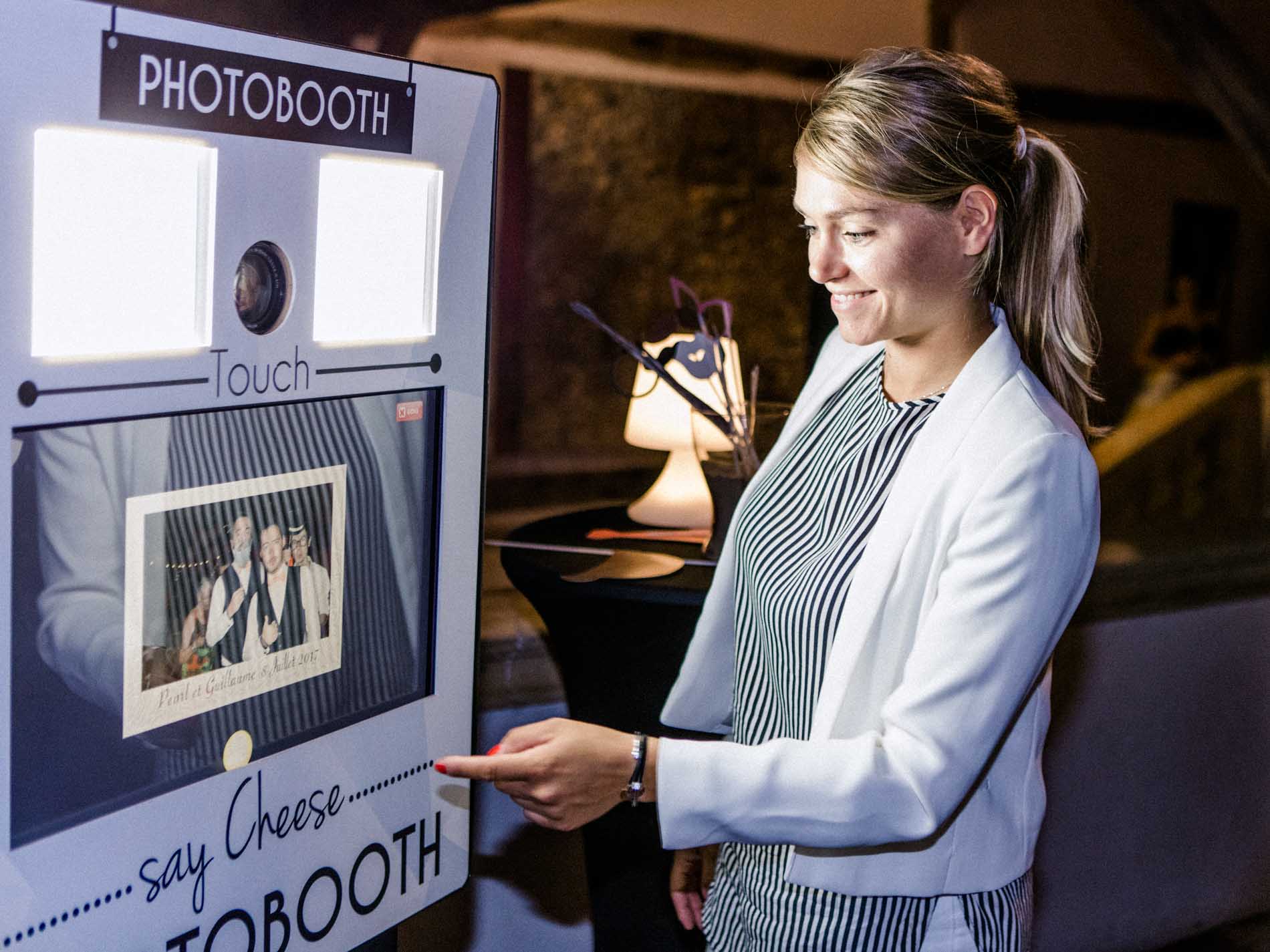 Guest trying out the photo booth during the wedding party