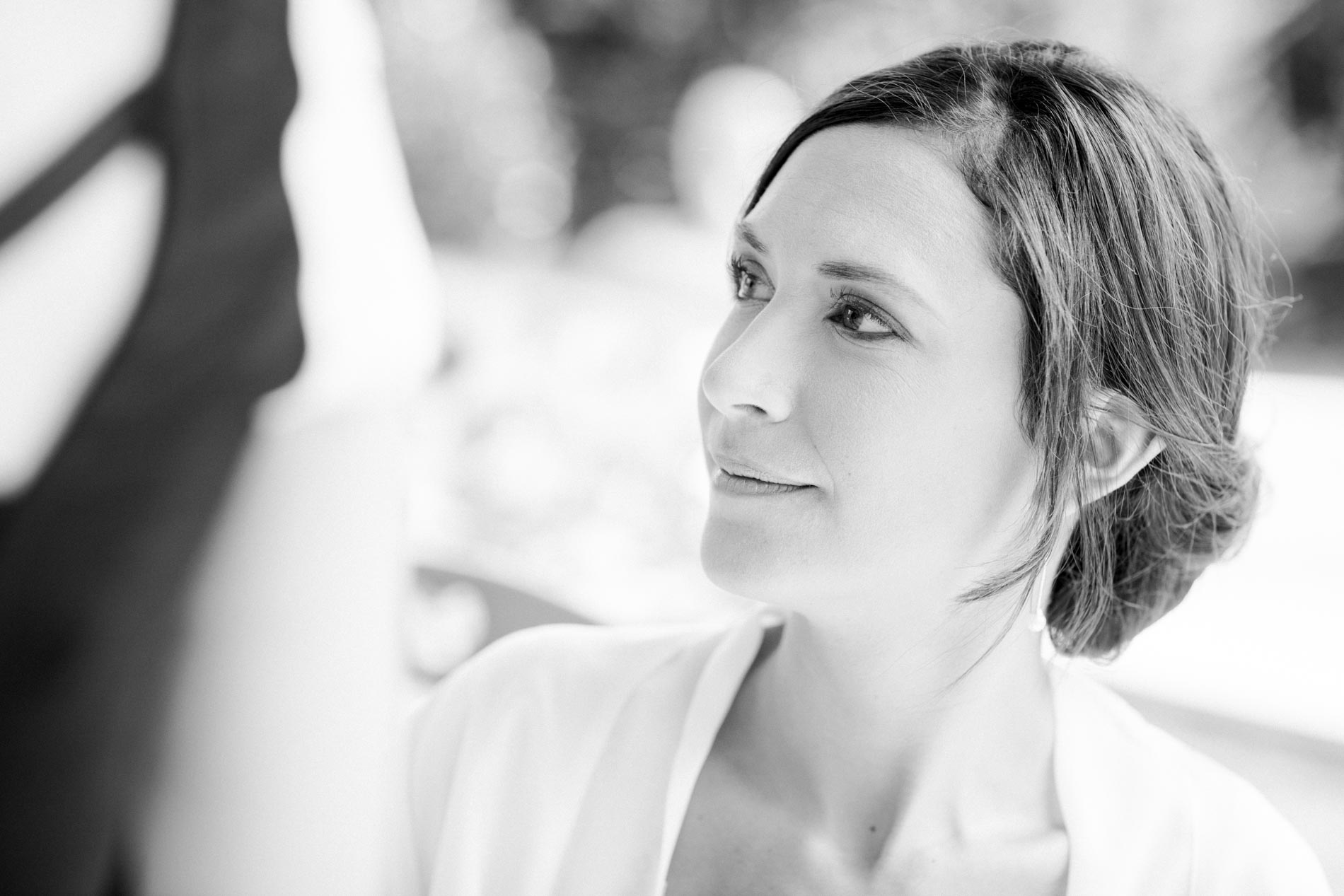 Profile of the bride with a low chignon, black and white photo