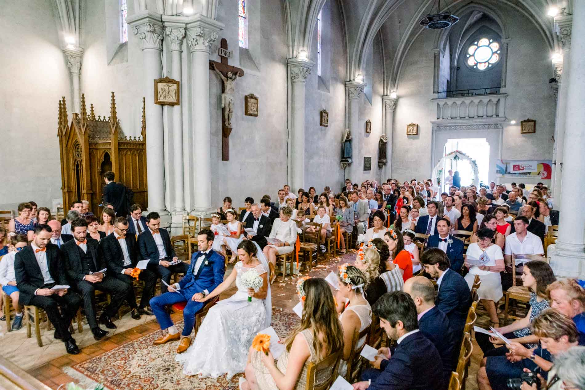 Guests filling the nave of Saint-Jean-d'Illac church during the ceremony