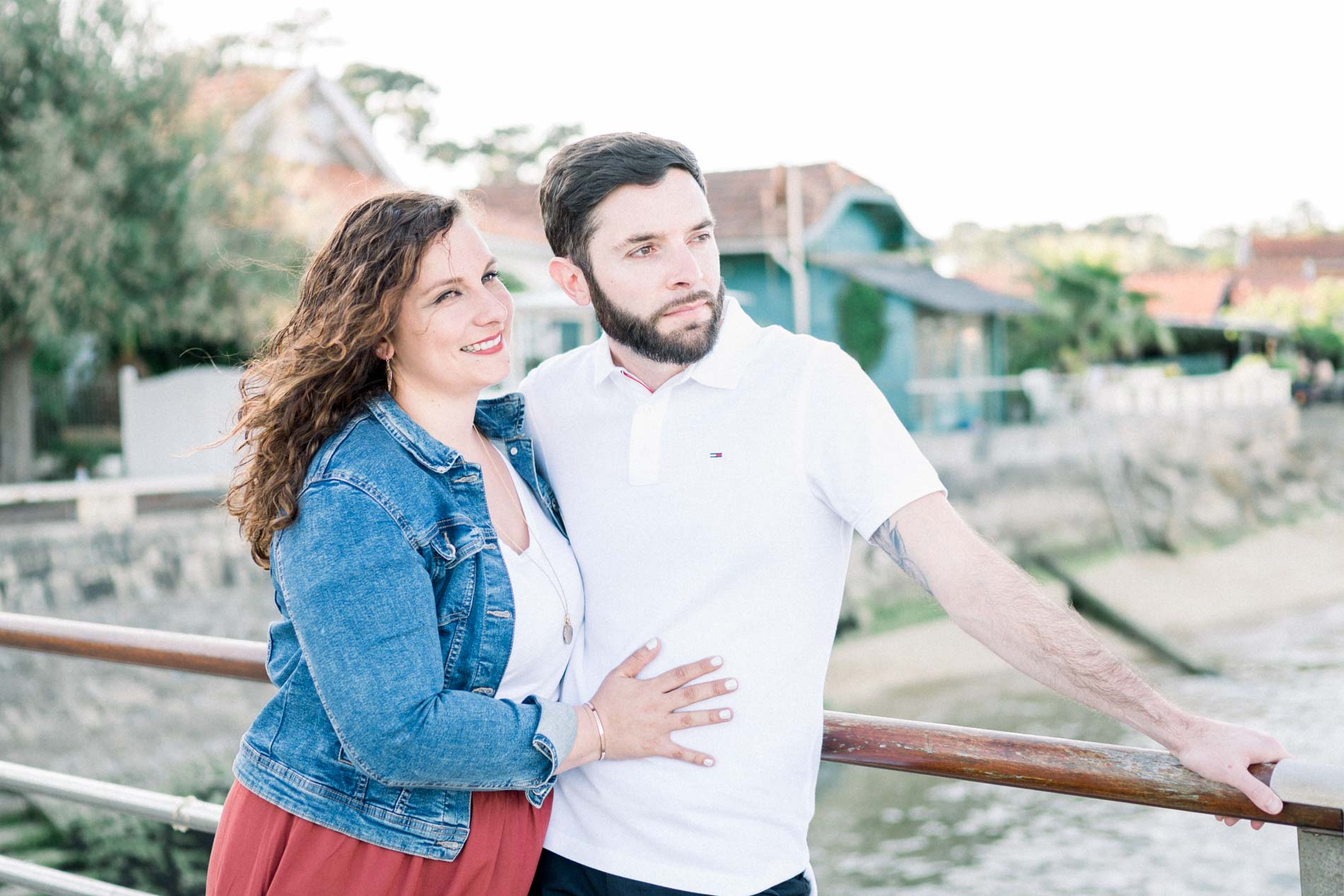 Couple leaning on a railing overlooking Arcachon Bay