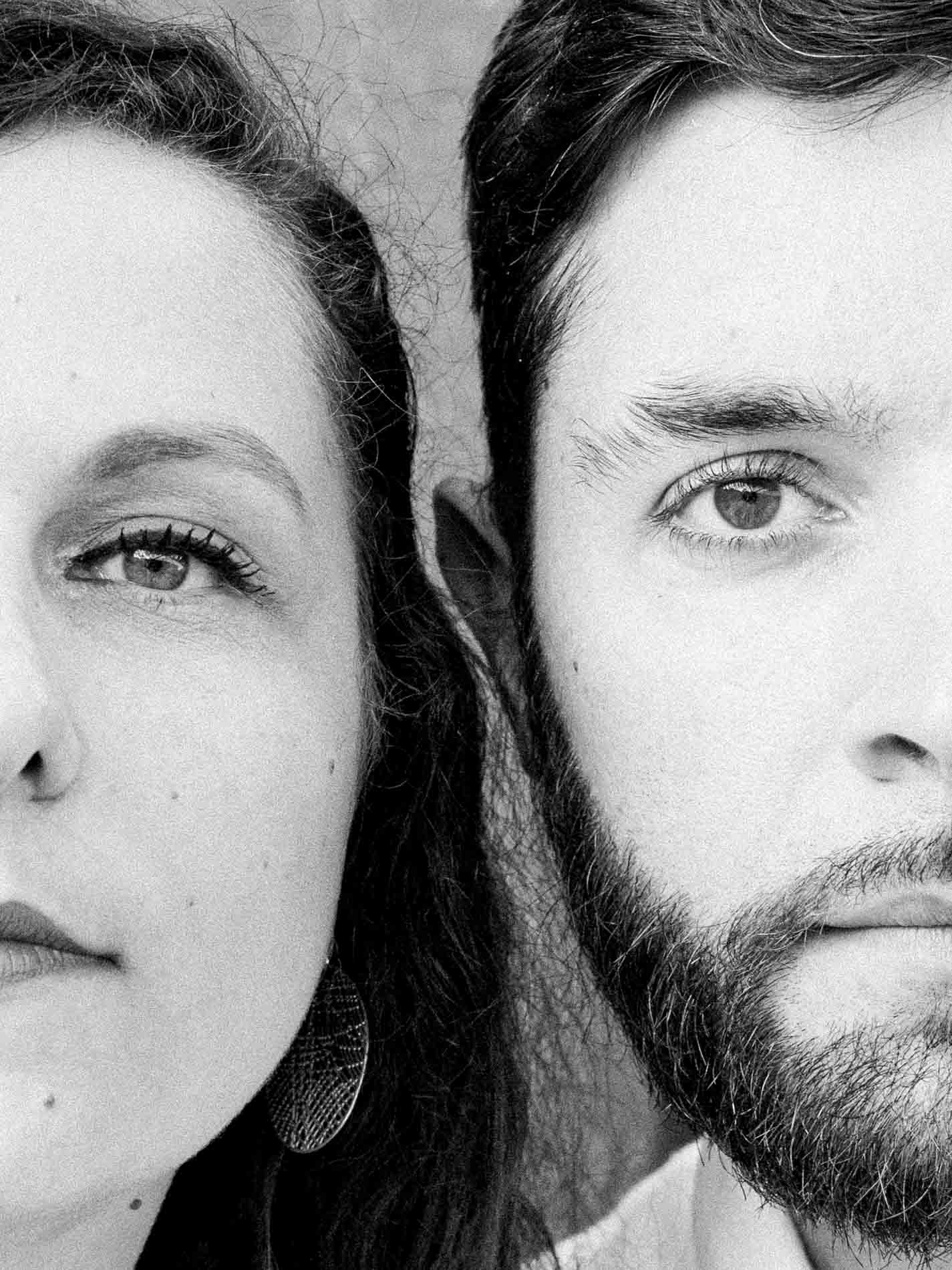 Close-up of the couple's faces side by side, black and white