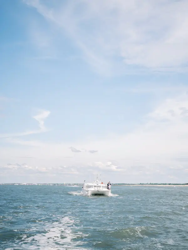 Motorboat speeding across Arcachon Bay during the couple's boat trip