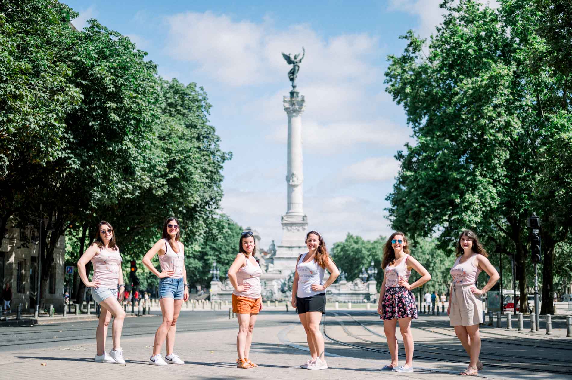 Hen party friends lined up before the Girondins monument