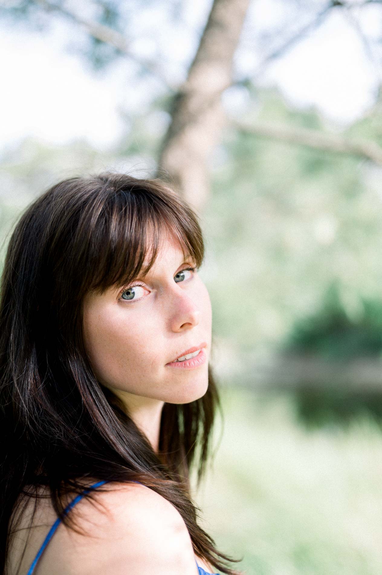 Portrait of the dark-haired bride-to-be with an intense gaze