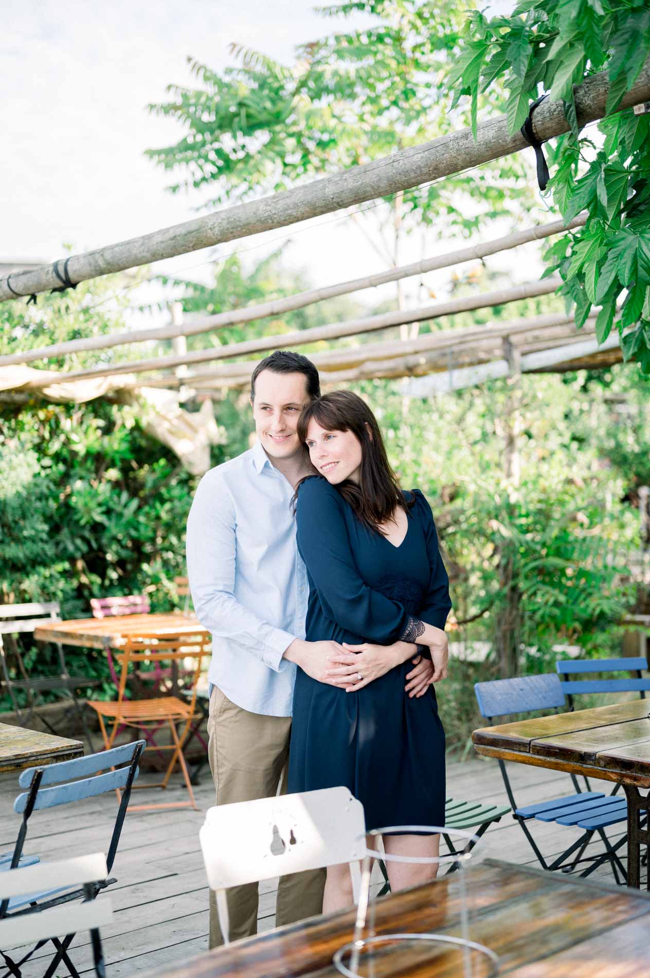 The couple embracing on a shady terrace in the village of L'Herbe