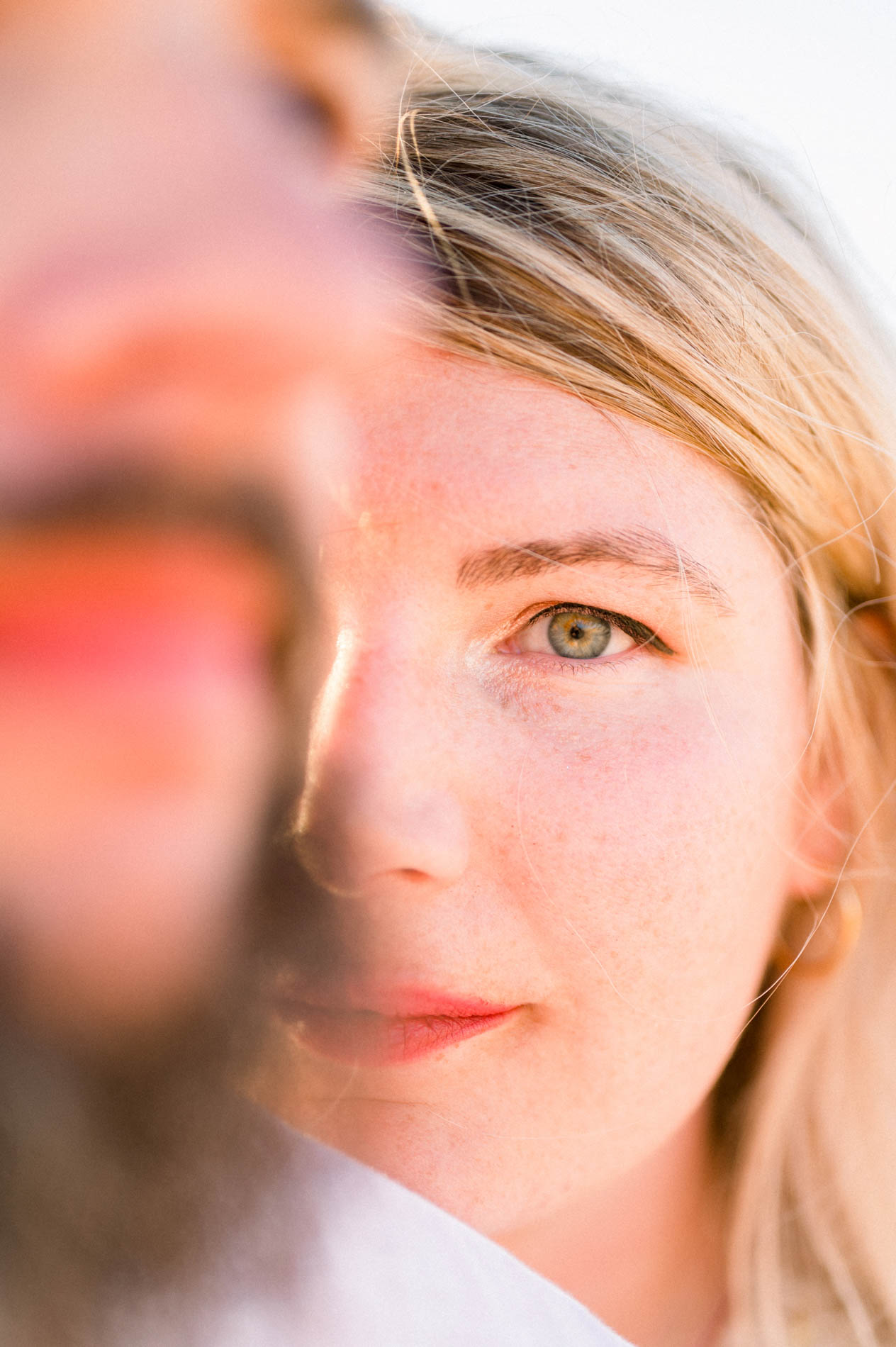 Close-up of the fiancée's eye behind Derek's blurred face