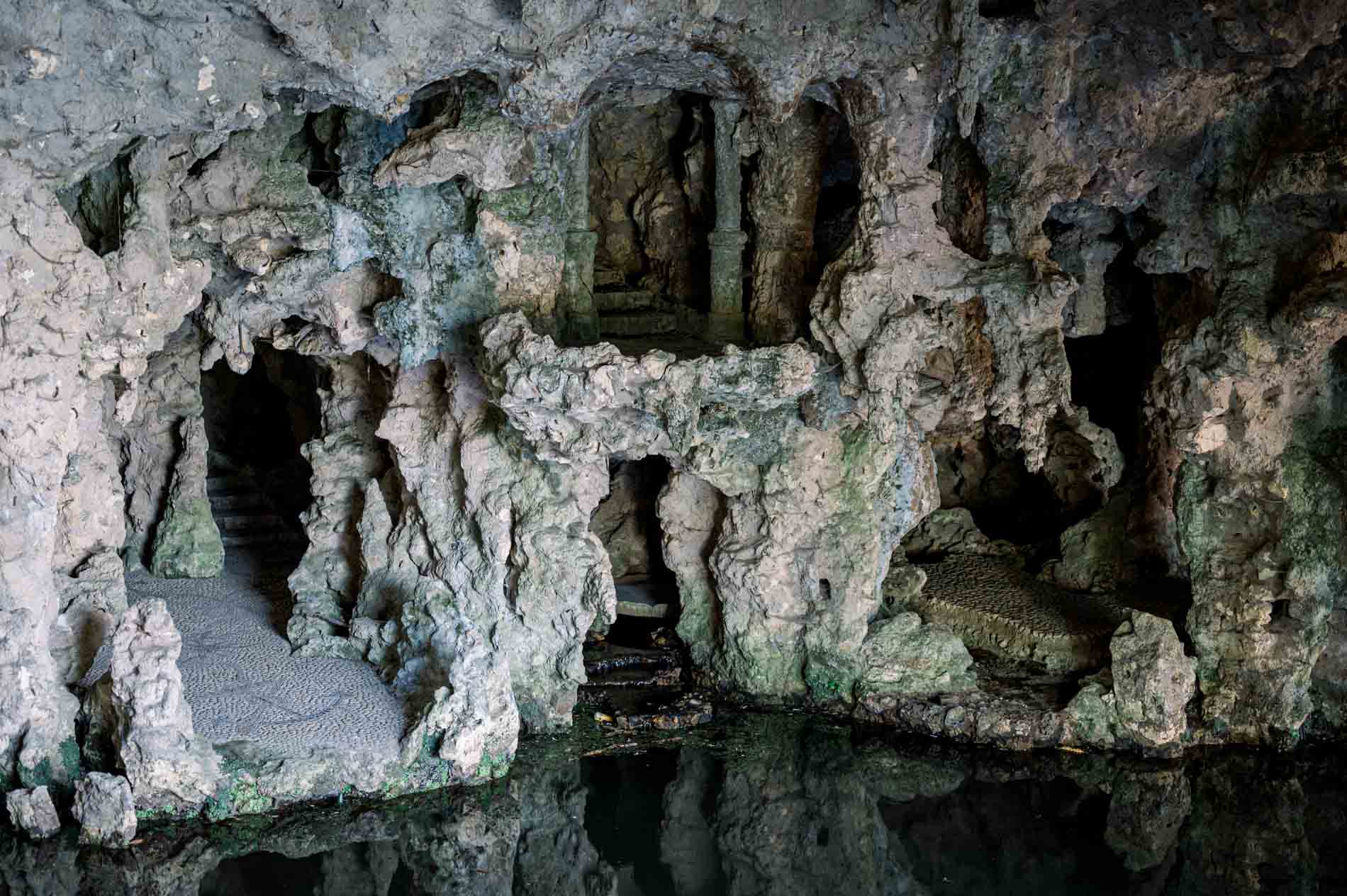Rockwork and stone grotto at the water's edge in Parc Majolan